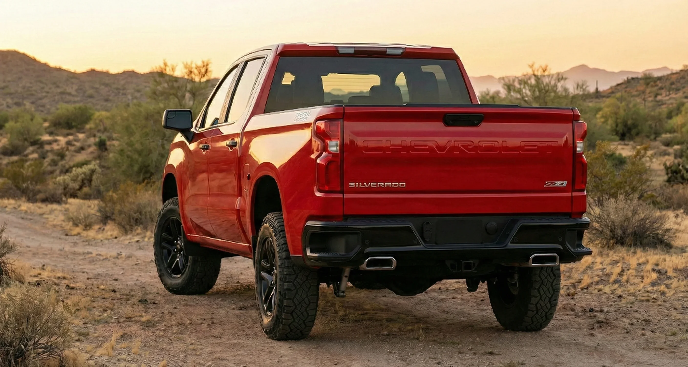2026 Silverado Trail Boss rear view showing dual exhaust, Trail Boss badge, and Multi-Flex tailgate